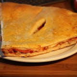 Mia Pizzeria's Meat Stuffed Pizza between two layers of crust